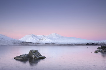 Loch at sunrise Rannoch Moor Glencoe Scottish highlands