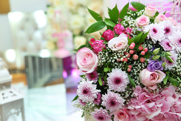 Multi-colored flower bouquet . Multi-colored engagement flower bouquet . Beautiful bouquet of colored roses wrap with white paper