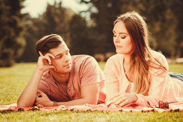 Couple on picnic date outdoor.