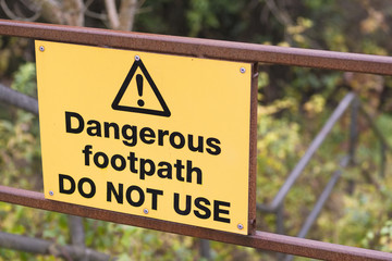 Dangerous footpath do not use sign on steep path to warn walkers