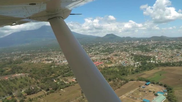 POV plane passing by Mount Meru