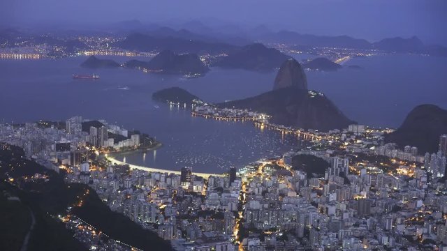 night shot of botafogo and mt sugarloaf from christ the redeemer in rio de janeiro, brazil