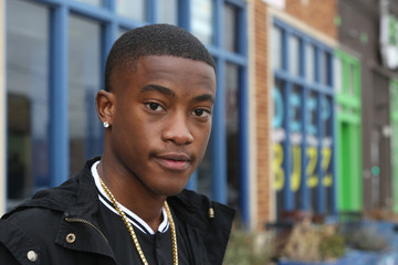 Colorful street scene portrait of a young African American male model