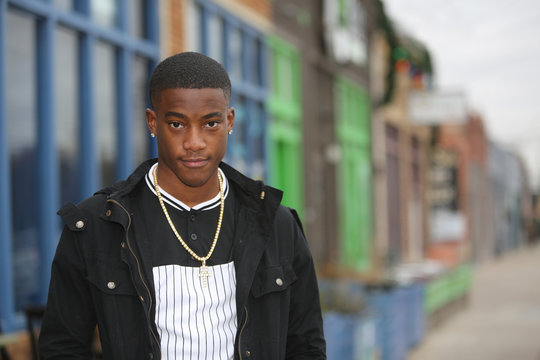 Colorful street scene portrait of a young African American male model