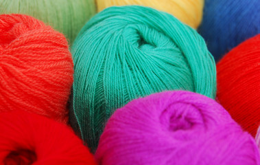 Close up view on knitting balls in different color