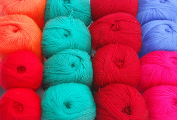 Close up view on knitting balls in different color