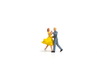 Miniature people, Couple romantic dancing on white background , Valentine's day concept