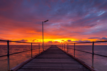 Fototapeta na wymiar A very dramatic sunset over the Port Noarlunga Jetty