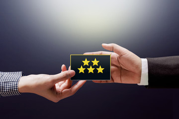 Customer Experience Concept, Happy Client Woman giving a Feedback with Five Star Rating on Card into a Hand of Businessman