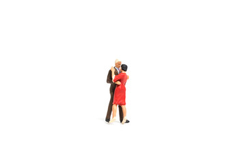 Miniature people, Couple romantic dancing on white background , Valentine's day concept