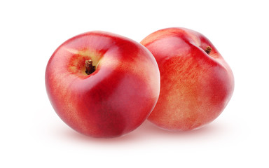 Two ripe nectarines, isolated on white background.