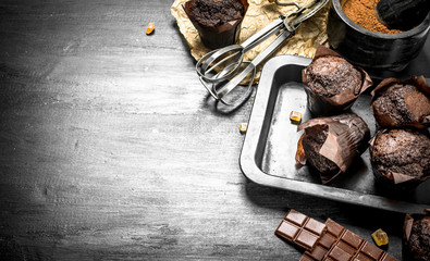 Chocolate muffins with ingredients.