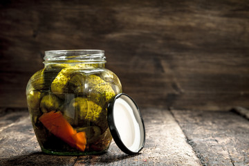 Marinated cucumbers in jar.