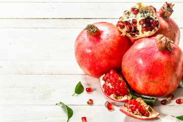 Ripe pomegranates with leaves.