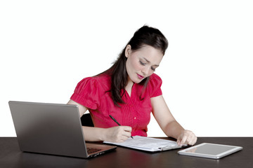 Young secretary is writing on the clipboard