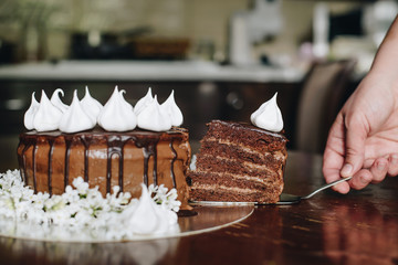hand cut with knife piece of cake