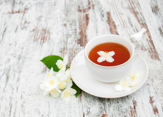 Cup of tea with jasmine flowers