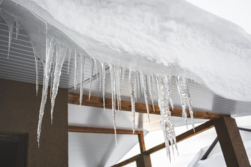 Icicles. Winter. Roof.