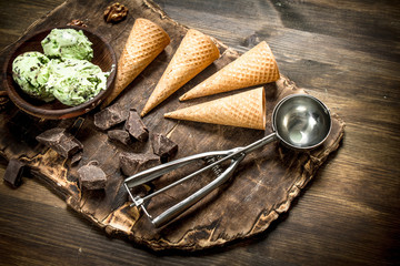 Fresh pistachio ice cream in a bowl with waffle cups.