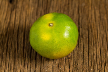 tangerine. sweet orange. on wooden. texture wooden