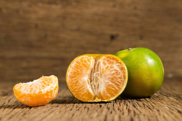tangerine. sweet orange. on wooden. texture wooden
