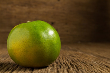 tangerine. sweet orange. on wooden. texture wooden