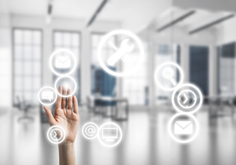 Modern office interior and close of businesswoman hand choosing 