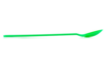 green spoon plastic isolated on white background