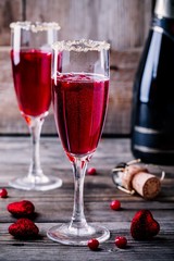 Refreshing cocktail with sparkling wine and cranberry for Valentine's day