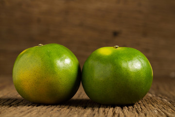 tangerine. sweet orange. on wooden. texture wooden