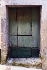 Two-piece wooden door very typical in the villages of Galicia in the ancient stone houses in a typical village of the Atlantic coast of La Coruna, Spain. Call Pontedeume
