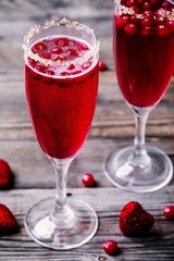 Refreshing cocktail with sparkling wine and cranberry for Valentine's day