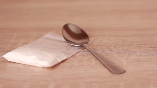 Putting heroin-cooking instruments on the table