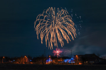 Fireworks show above the houses