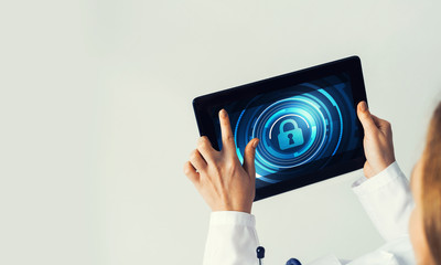 Close of female doctor hands working with tablet pc computer