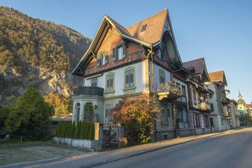 Fototapeta na wymiar Interlaken,Switzerland. 31 October 2017 : Old Swiss House in old town area Interlaken with Mountain.