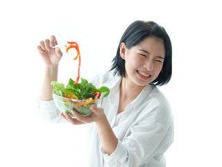 Asian woman hating salad vegetable diet food