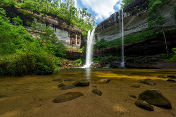 Beautiful Huay Luang waterfall in green forest in jungle, Ubon Ratchathani, Thailand.