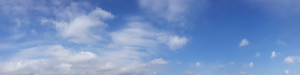 Vibrant color panoramic sky with cloud on a sunny day. Beautiful cirrus cloud. Panorama high resolution photograph.