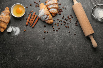 Composition with tasty croissants on dark background