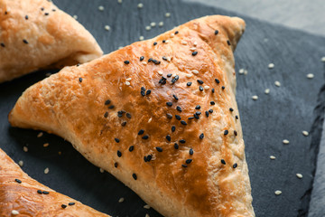 Slate plate with delicious samosa, closeup