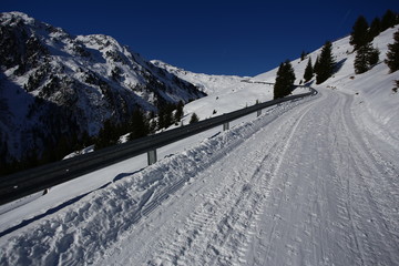 Wintery mountain landscape with sunshine