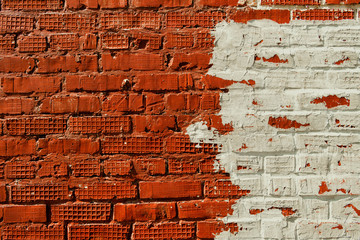 Texture of old brick wall surface. Bicolor wall. Old brick wall texture background