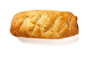 Baked bun on a white background close-up. Isolate.