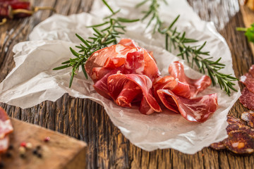 Coppa di Parma ham with fresh rosemary.