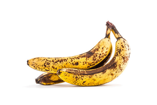 Banana. Over ripe bananas isolated on white with shadows
