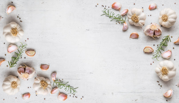 Garlic. Garlic bulbs. Fresh garlic with rosemary and pepper on w