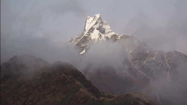 Machapushre (Fishtail) peak and clouds. Nepal, Himalayas. Timelaps