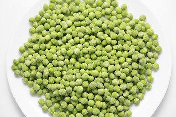 Frozen green peas on a plate