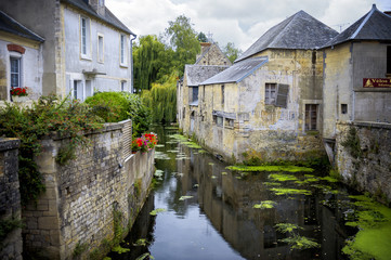 Fototapeta na wymiar Bayeux, France - Scene of Bayeux with a waterway named the Aure.
